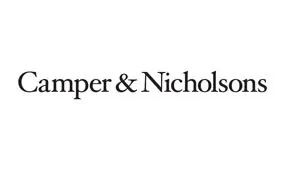 The image shows the logo for Camper & Nicholsons, with the company name written in a classic black serif font on a white background.