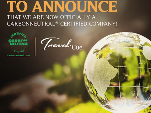 A digital announcement with a glass globe on a leafy surface, stating that Travel Cue is now officially a CarbonNeutral® Certified Company. Certification and website are also shown on the left side.
