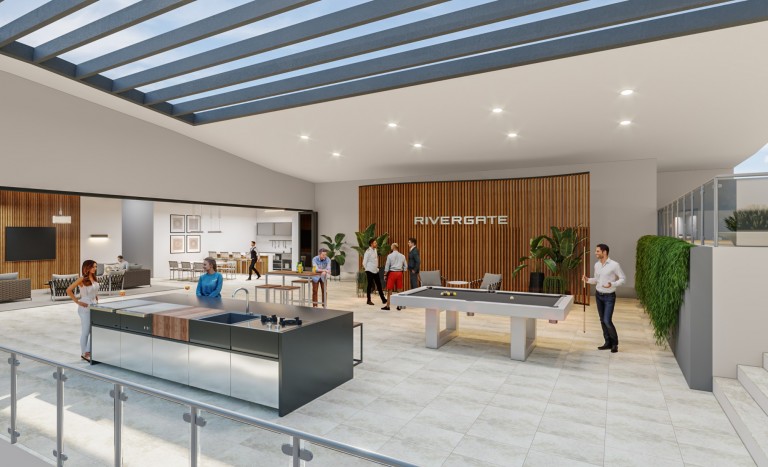 A modern indoor leisure area with people playing pool, socialising, and preparing food. The space has large windows, a skylight, plants, a TV area, and the word RIVERGATE on a wood-panelled wall.