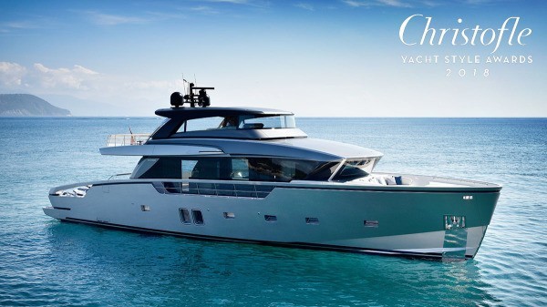 A sleek, modern yacht floats on calm blue water under a clear sky, with Christofle Yacht Style Awards 2018 written in elegant white text in the top right corner.