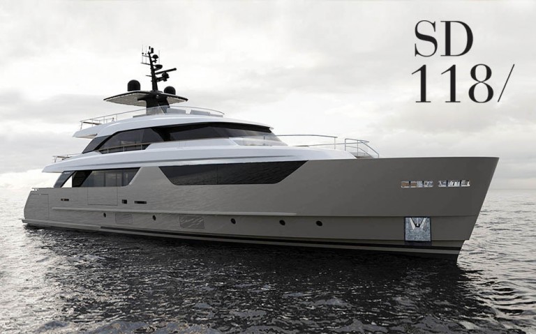 A modern luxury yacht with sleek lines floats on calm water under a cloudy sky. The text SD 118/ is displayed in the upper right corner.