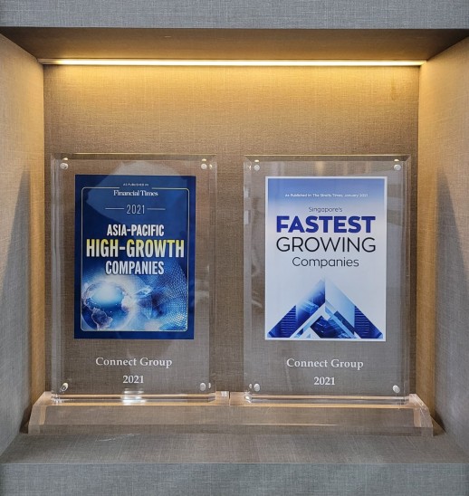 Two glass awards on display. The left award reads, 2021 Asia-Pacific High-Growth Companies, and the right reads, Singapore’s Fastest Growing Companies 2021. Both are awarded to Connect Group.