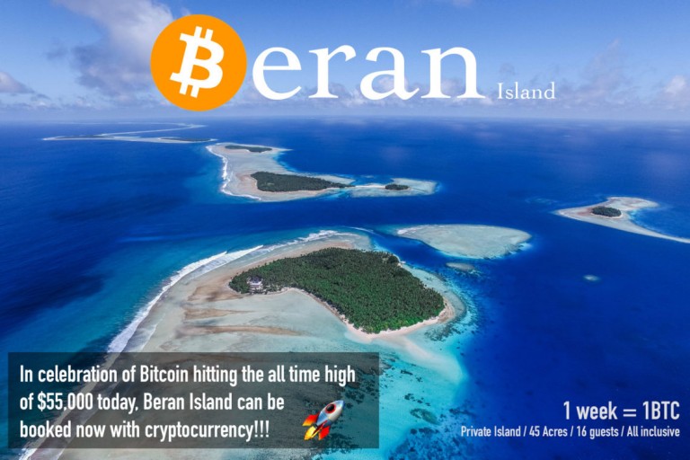 Aerial view of a tropical island with turquoise waters and lush greenery. Text reads: Beran Island. In celebration of Bitcoin hitting $55,000, Beran Island can be booked now with cryptocurrency! 1 week = 1BTC.