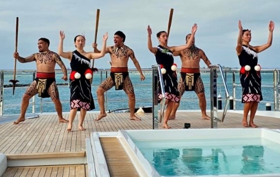 Maori performing arts specialists delivering a haka onboard a superyacht