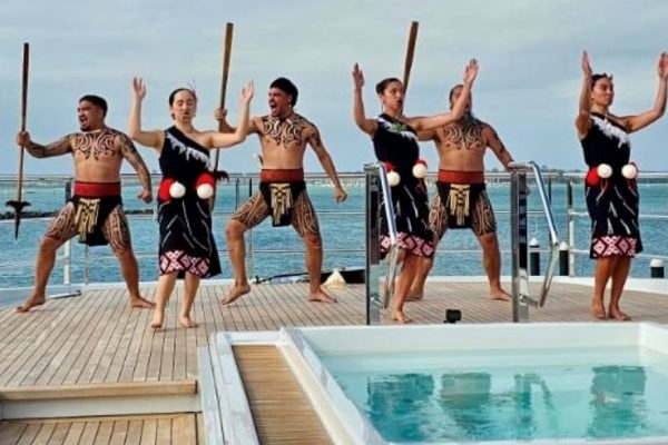 Maori performing arts specialists delivering a haka onboard a superyacht