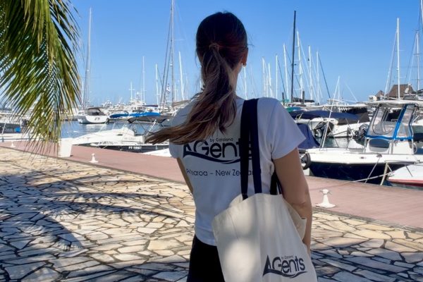 Catalano Agents team member at Marina de Papeete, Tahiti, with fleet of yachts in background