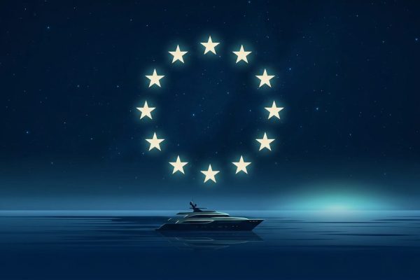 A ring of stars over a motor yacht on calm night water